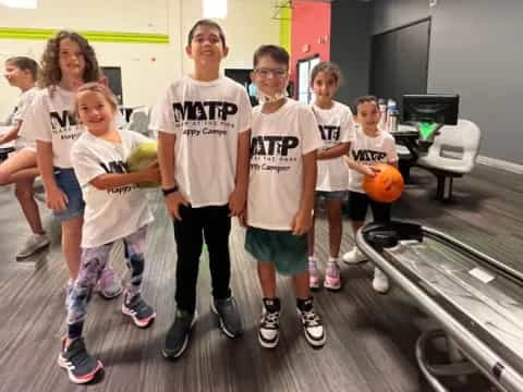 a group of kids posing for a photo