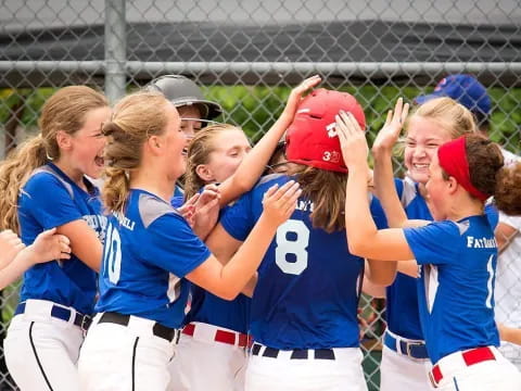 a group of girls in blue shirts