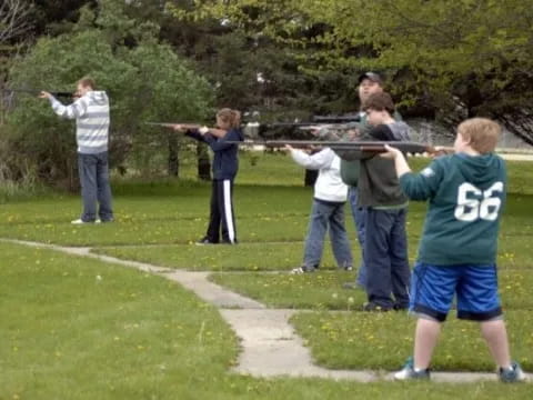 a group of people holding a large sword