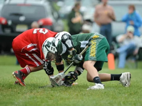 a group of people playing lacrosse