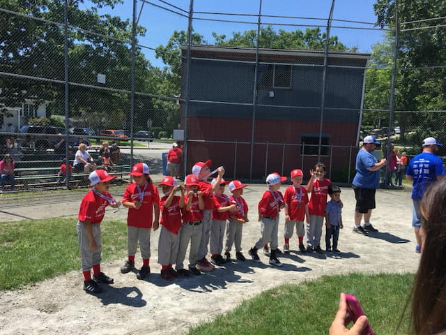 a group of kids in red uniforms