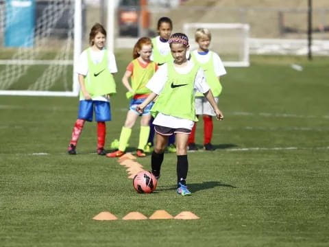 a group of girls playing football