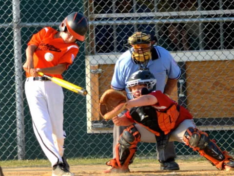 a baseball player swings a bat