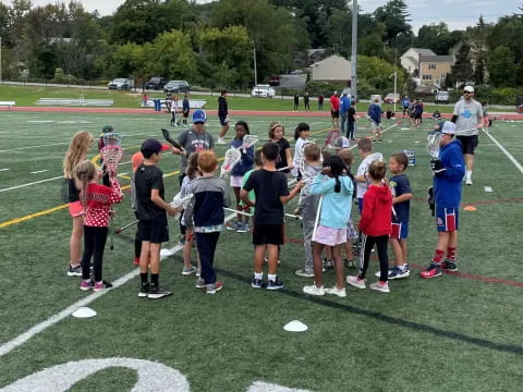 a group of people on a football field