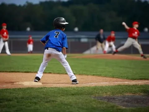 a kid swinging a baseball bat