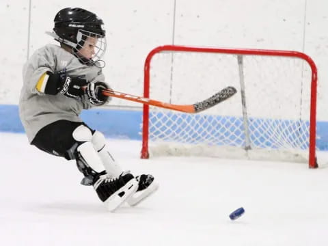 a hockey player in a white uniform