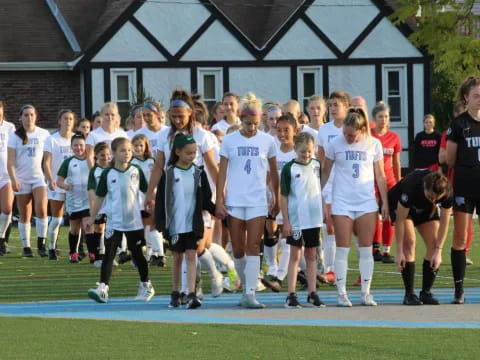 a group of girls in a football field