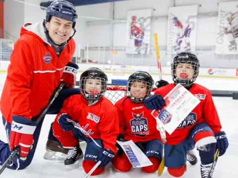 a group of hockey players on the ice