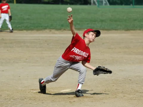 a baseball player throwing a ball