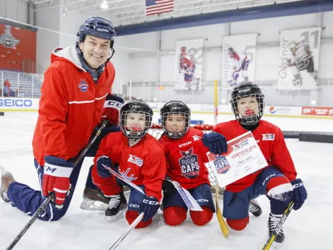 a group of people wearing hockey uniforms and holding hockey sticks