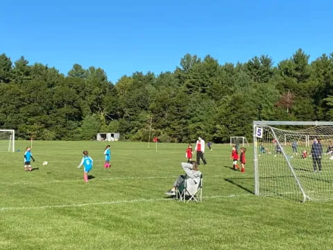 a group of kids playing football