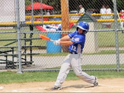 a young boy playing baseball