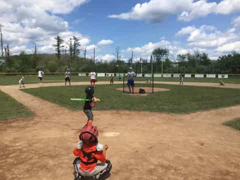 a group of people playing baseball