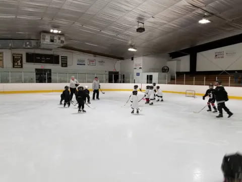 a group of people playing hockey