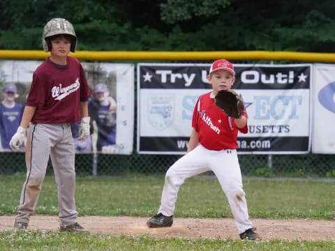 a couple of kids playing baseball