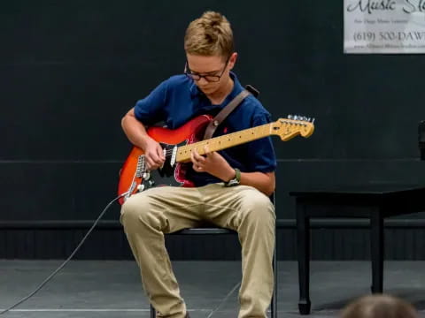 a man playing a guitar