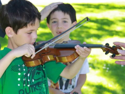 a boy playing a violin