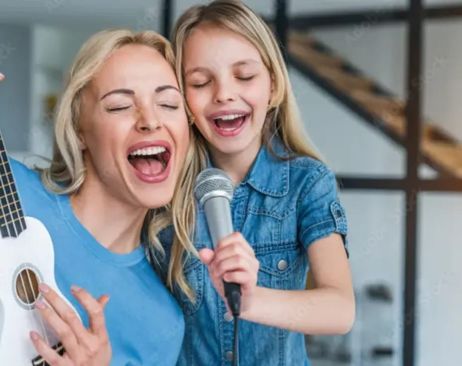 a couple of girls singing into microphones