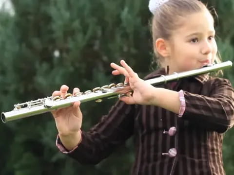 a girl holding a snake