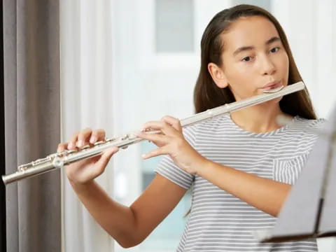 a girl playing a flute