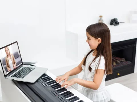 a woman playing a piano