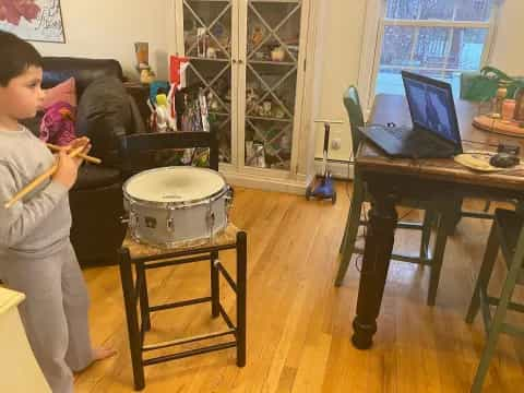 a boy playing drums