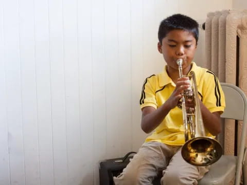 a boy playing a saxophone