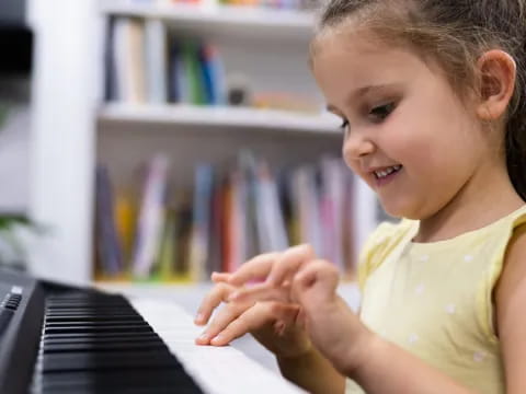 a young girl using a laptop