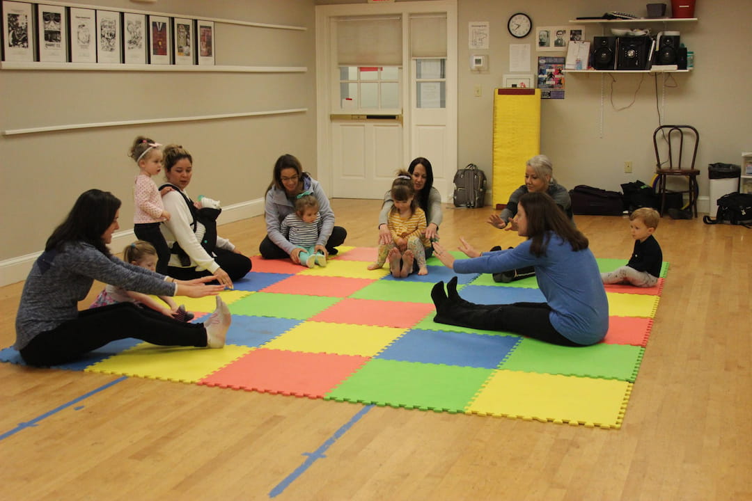 a group of people sitting on the floor