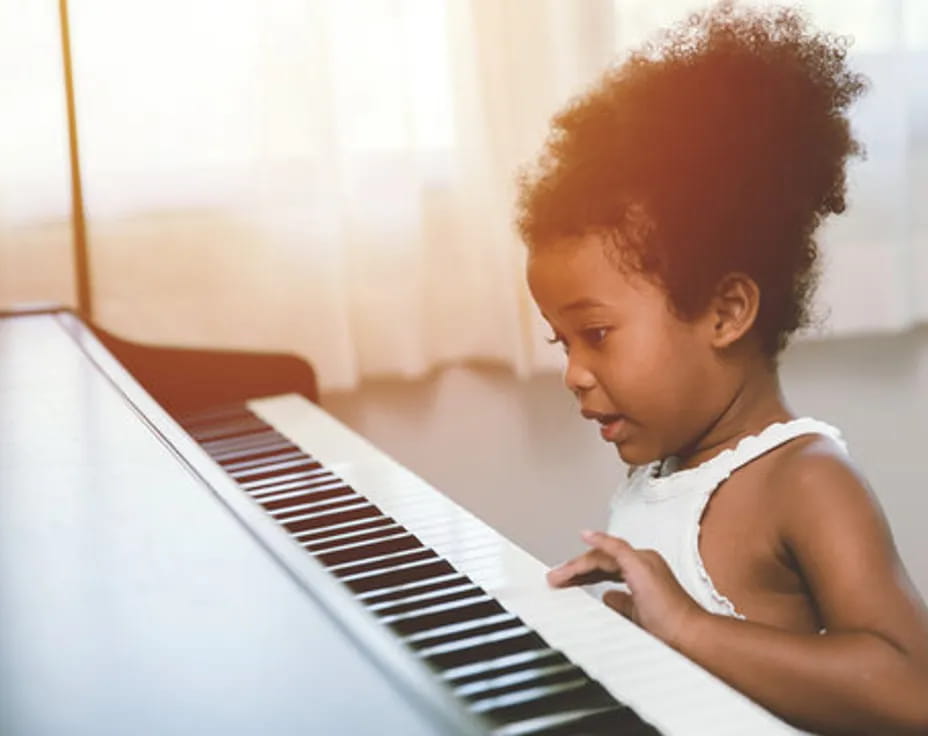 a baby playing piano