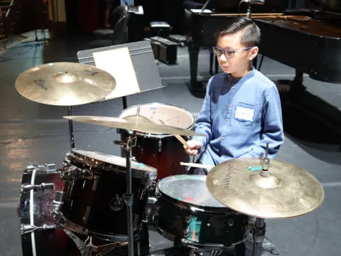 a boy playing drums