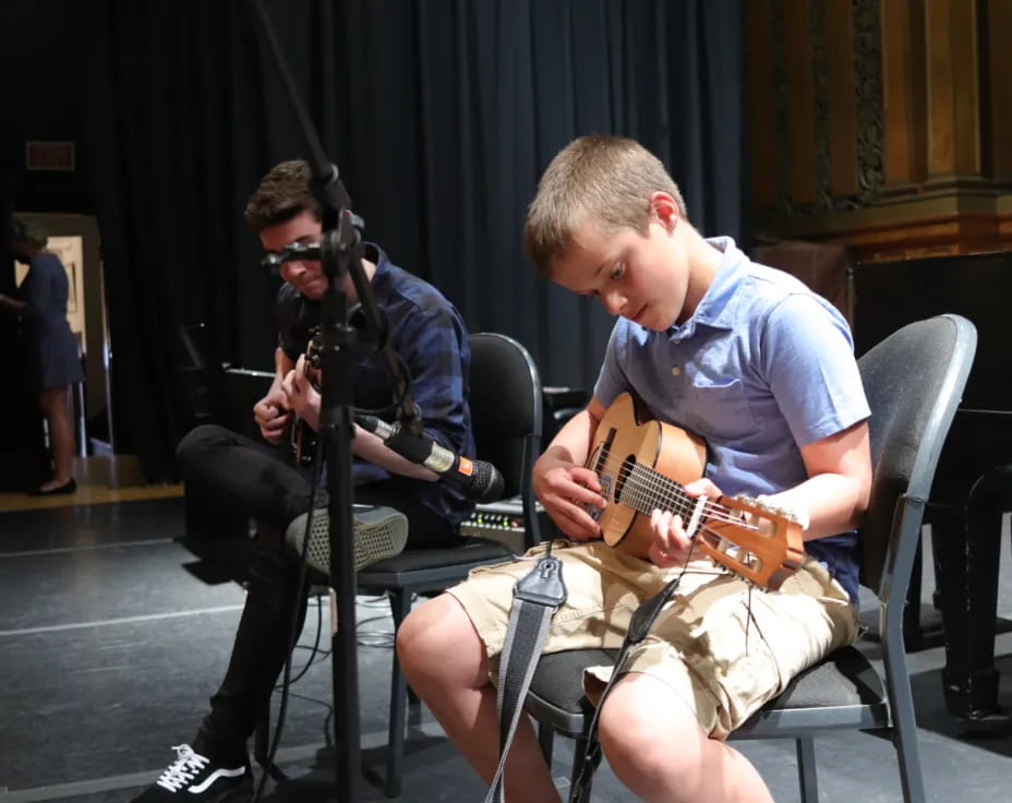 a man playing a guitar