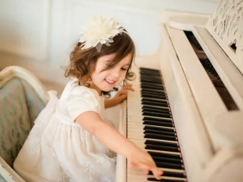 a girl playing the piano