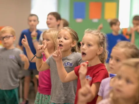 a group of children clapping