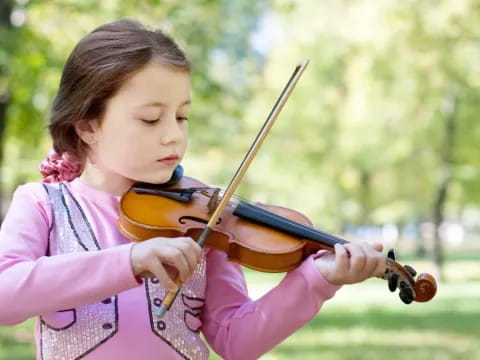 a girl playing a violin