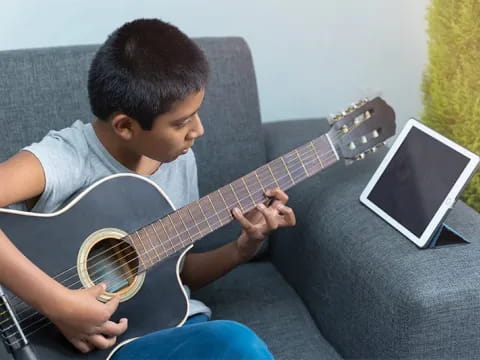 a person playing a guitar