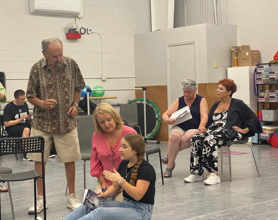 a group of people sitting in a room