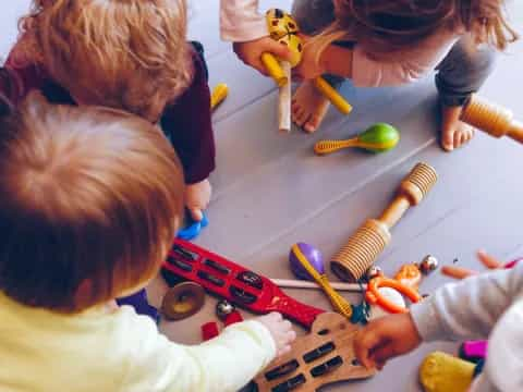 a group of children playing with toys