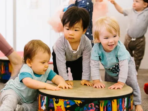 a group of children playing with a puzzle
