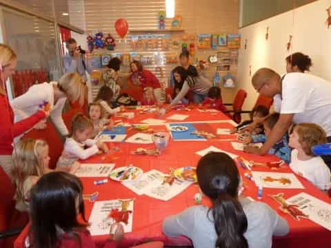 a group of people sitting around a table