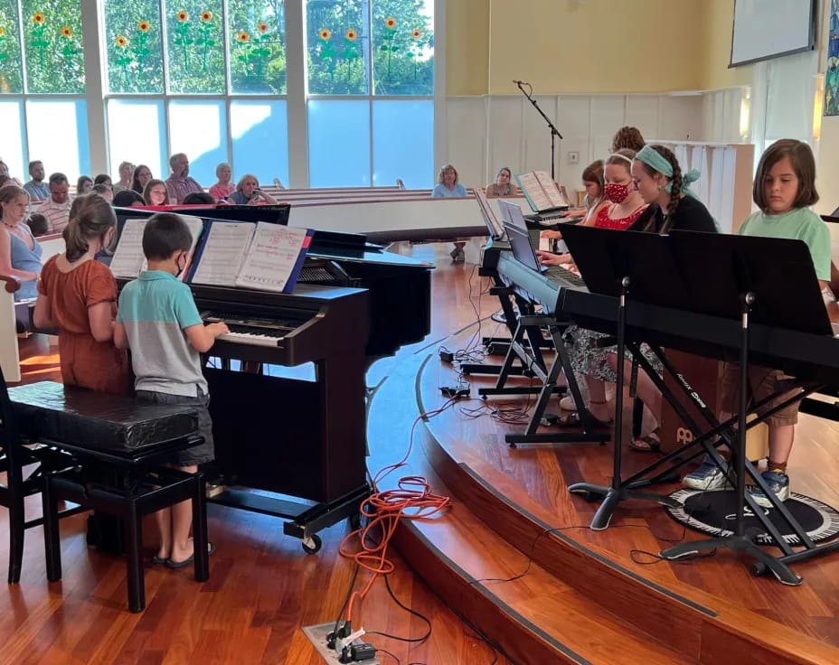 a group of kids playing musical instruments