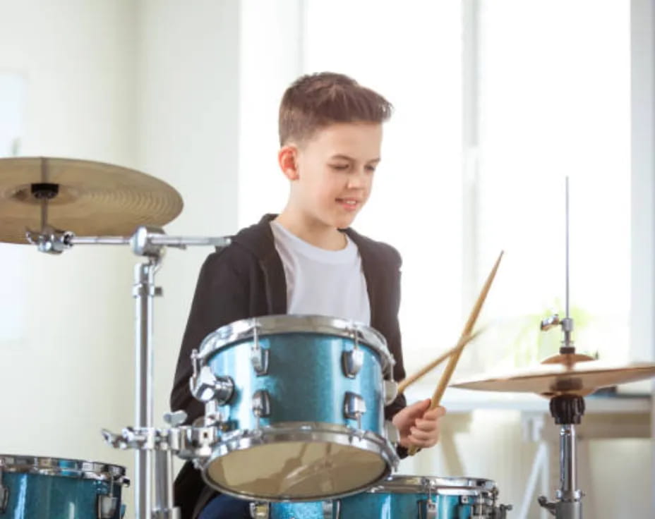 a boy playing drums