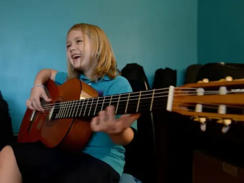 a person playing a guitar