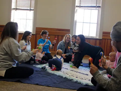 a group of people sitting on the floor