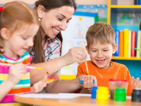 a person and children painting