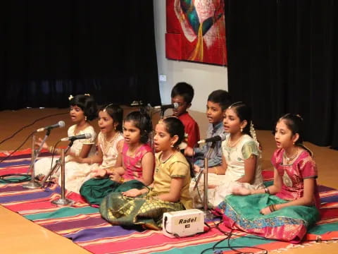 a group of children sitting on the floor