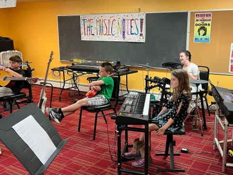 a group of kids playing instruments