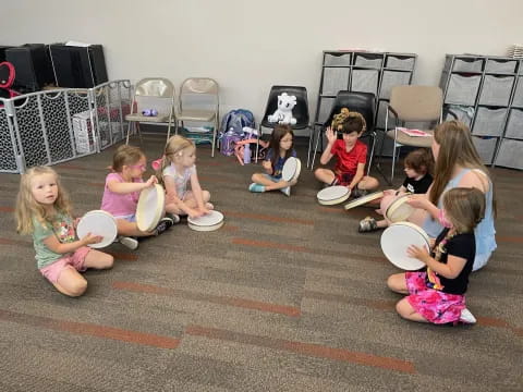 a group of children sitting on the floor