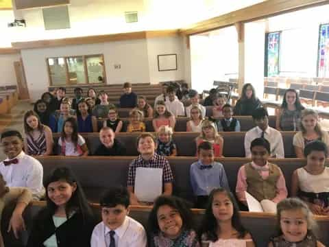 a group of people sitting in a room