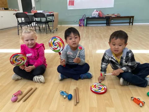 a group of kids playing with toys